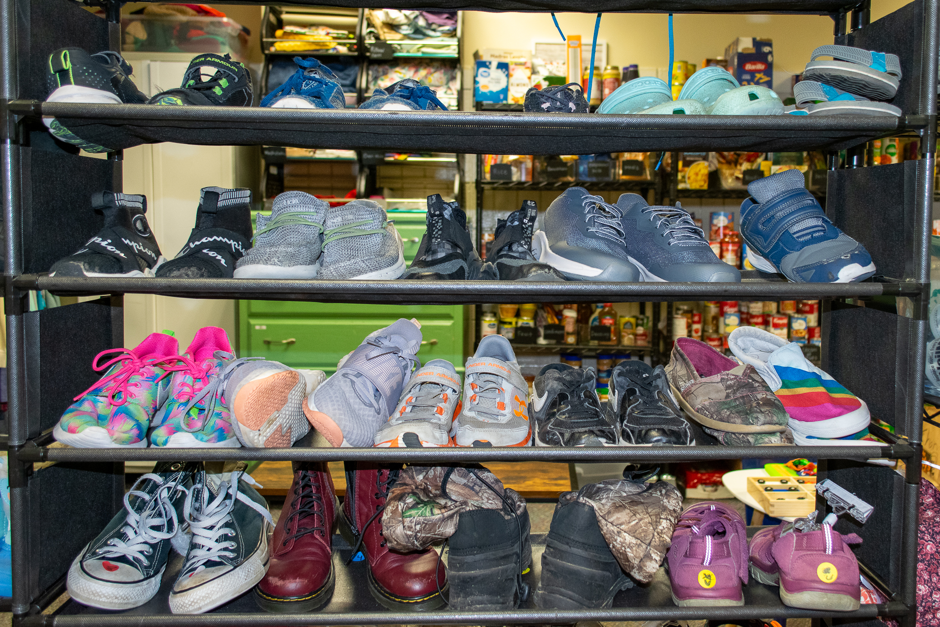 Photo of shoes on a metal shelf